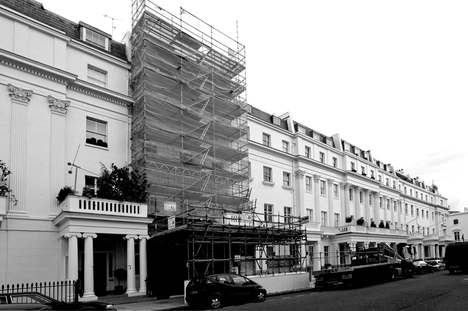 A smart town-house renovation covered with scaffolding.